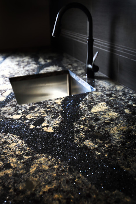 Quartz counter, undercount stainless steel sink. Oil rubbed bronze faucet. By House of J. Edmonton, Alberta.